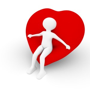 person sitting in a chair in the shape of a heart