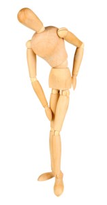 Joint pain at wooden mannequin isolated on white